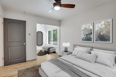 Bedroom featuring baseboards, light wood-style fl