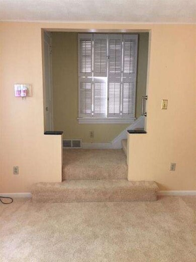 Living room stair landing. Harwoods under carpet. 