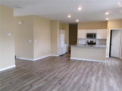 Kitchen featuring stainless steel appliances, whit