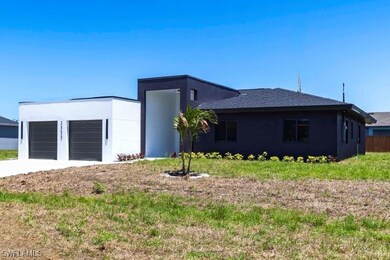View of front of home featuring stucco siding, an