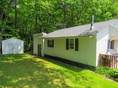 Side of home. Both sheds have electricity to them.