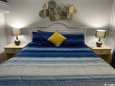 Bedroom with a wall unit AC