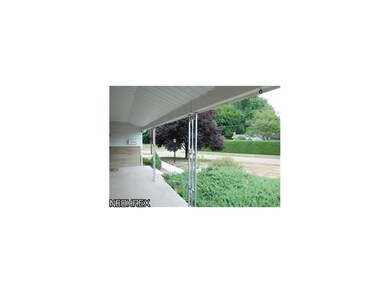 Nature stone covers the front porch.