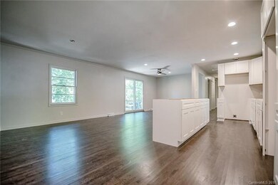 The kitchen is functional with a generous island f