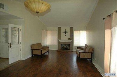 Living room and dining room showcasing a cozy fire
