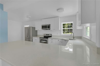 Kitchen featuring appliances with stainless steel