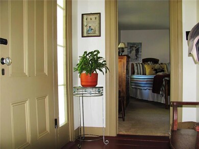 Front door is located between living...