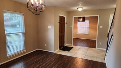Opposite the living room, a comfortable dining room opens to the foyer.