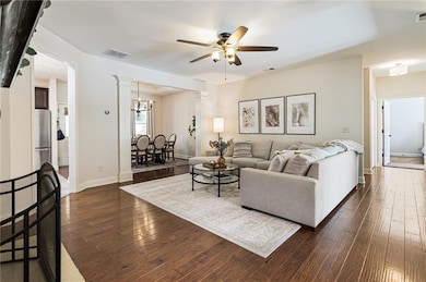 Light and airy great room with pristine hardwood f