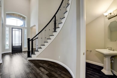 Entry with stairwell and half bath