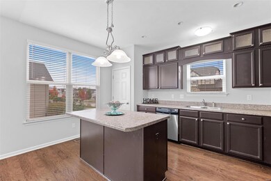 Lots of natural light in the kitchen. Island overh