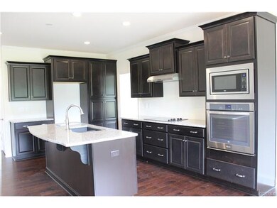 Alternate kitchen layout. Wall oven, granite, rece