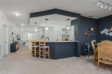 Kitchen featuring pendant lighting, a breakfast ba