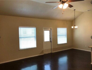 Foyer entrance with lofted ceiling and ceiling fan