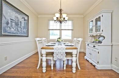Formal dining room with crown molding.