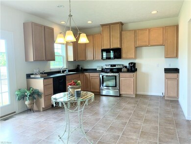 A sizable pantry, many cabinets, & eat-in area mak