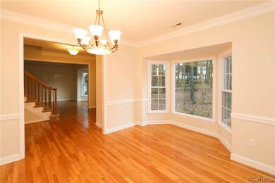 Formal dining room with bay window