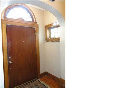 This home features original woodwork and arched do