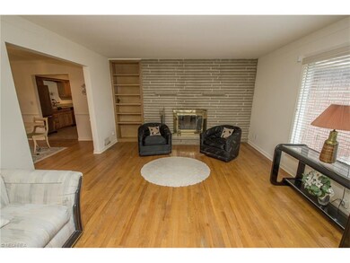 Formal living room with fireplace, owner says they