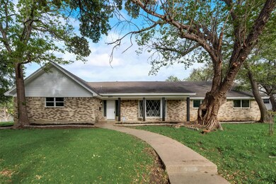 Single story home with a front lawn
