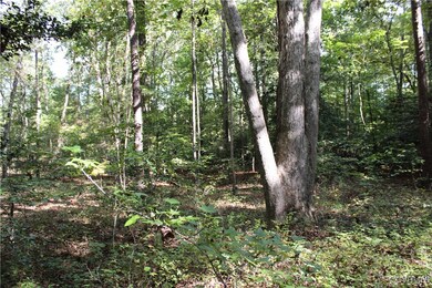View of landscape featuring a view of trees