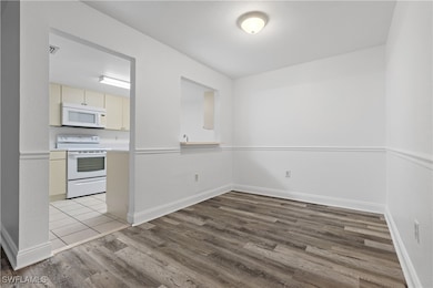 Kitchen with light hardwood / wood-style flooring,