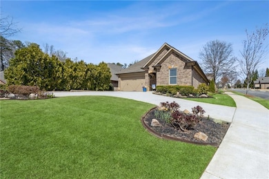 View of front facade featuring curved driveway and