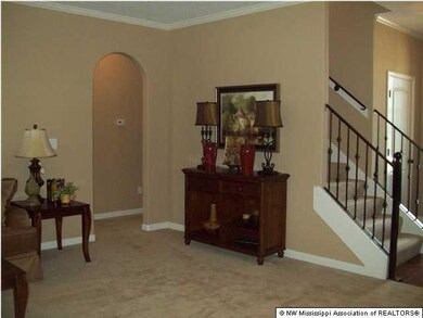 Family room View with arches and staircase to the 