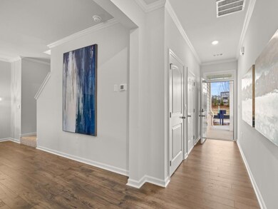 Sudbury townhome front entry hallway open to the l