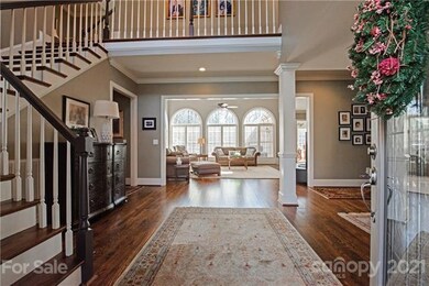 Enter to a gorgeous two-story entryway with beauti
