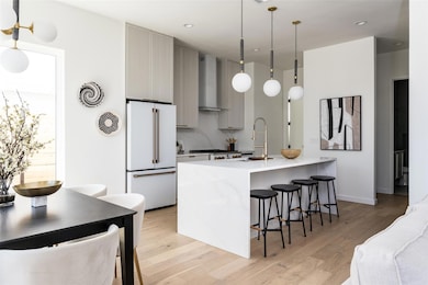 Kitchen featuring high end white refrigerator, li