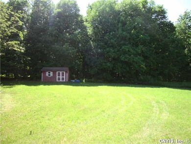 Land. back yard/storage shed