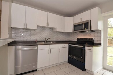 Kitchen with new countertops & appliances!