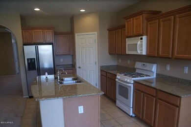 Kitchen with gas range and granite tops