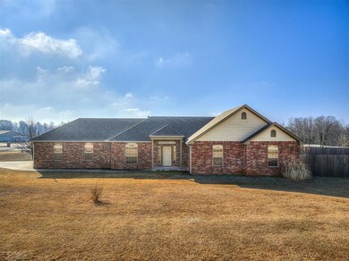 Ranch-style house with a front lawn