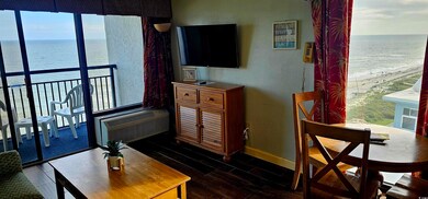 Living room with dark wood-type flooring