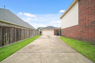 View to driveway, 2 car detached garage and side e