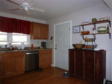 Kitchen with entry to garage. SS Dishwasher is 5 y