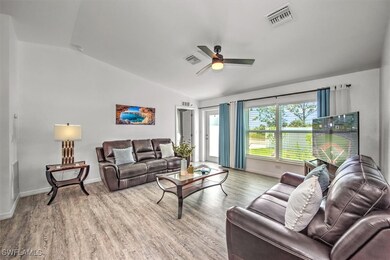 Living area featuring wood finished floors, lofted
