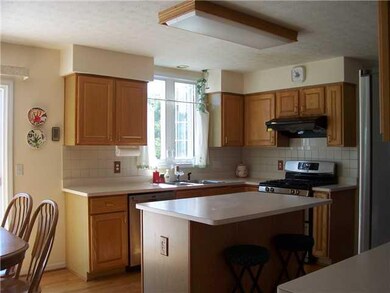 Exterior Front. Medium oak kitchen with center isl