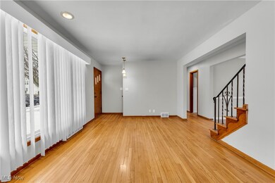 Empty room with light hardwood / wood-style flooring and a wealth of natural light