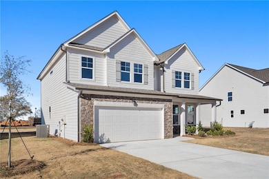 View of front of home featuring central air condit