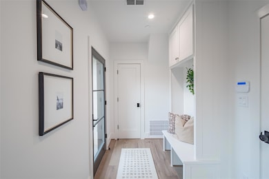 Mudroom featuring light hardwood / wood-style floo