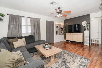 Living room featuring hardwood / wood-style floori