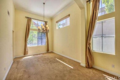 Light-filled formal dining room with upgraded eleg