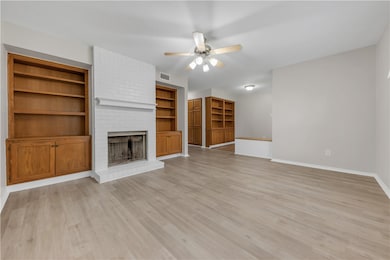 Unfurnished living room featuring visible vents, a