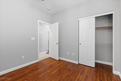 First floor bedroom featuring wood finished floors