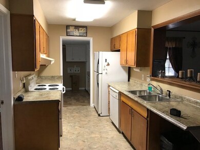 KITCHEN FROM D.R., w/ LAUNDRY BEYOND.