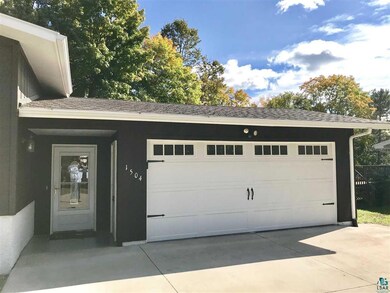 NEW INSULATED OVERHEAD DOOR & NEW OPENER.