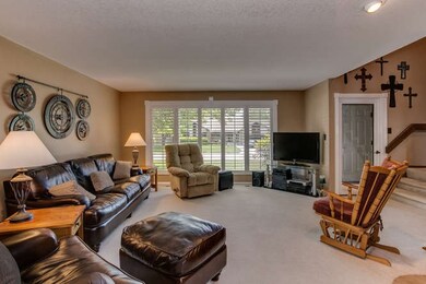 Large Front Windows with Attractive Wood Shutters